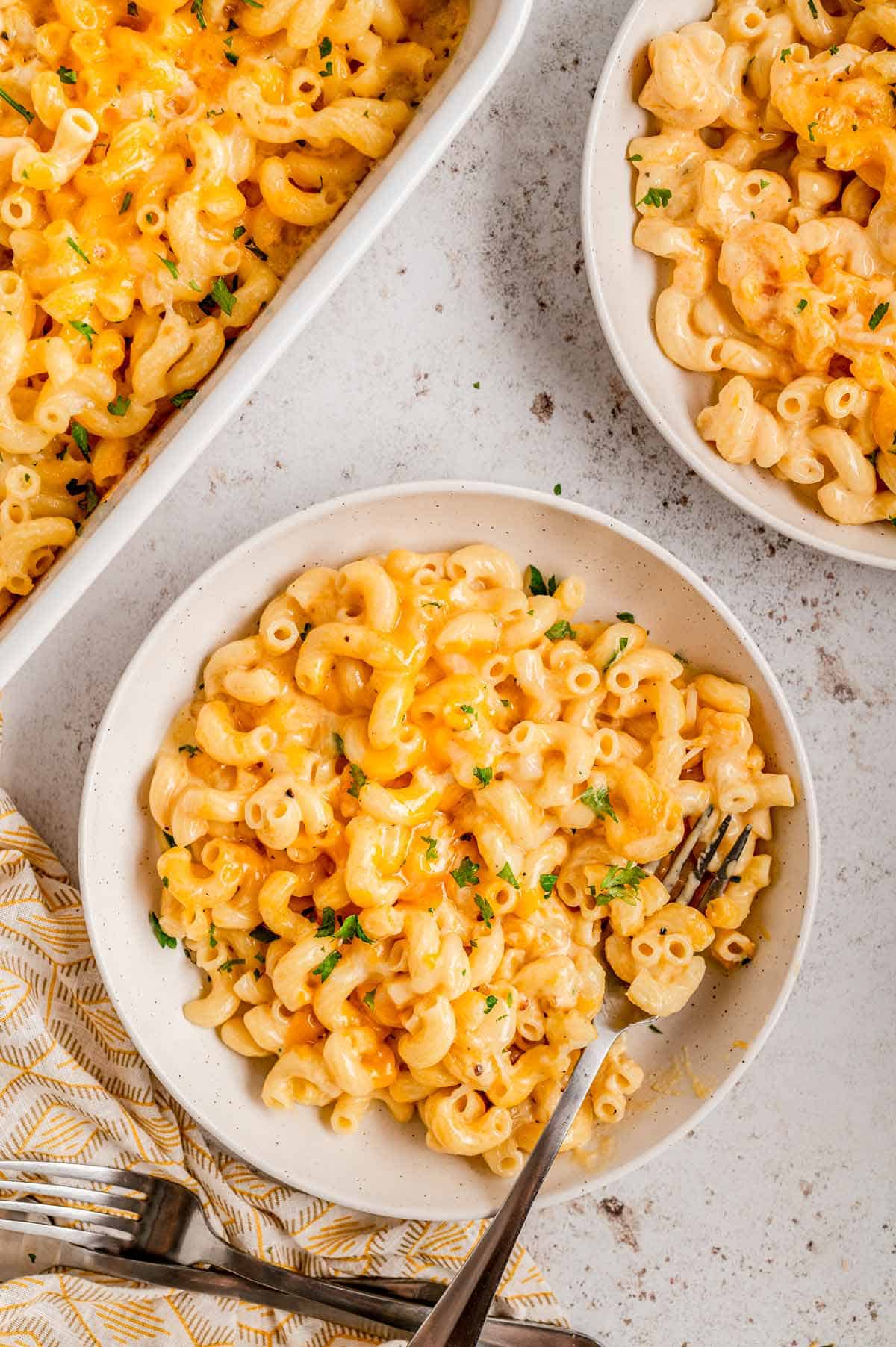 Baked mac and cheese without flour in a white bowl.