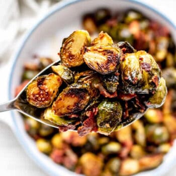Roasted maple bacon brussel sprouts on a serving spatula.