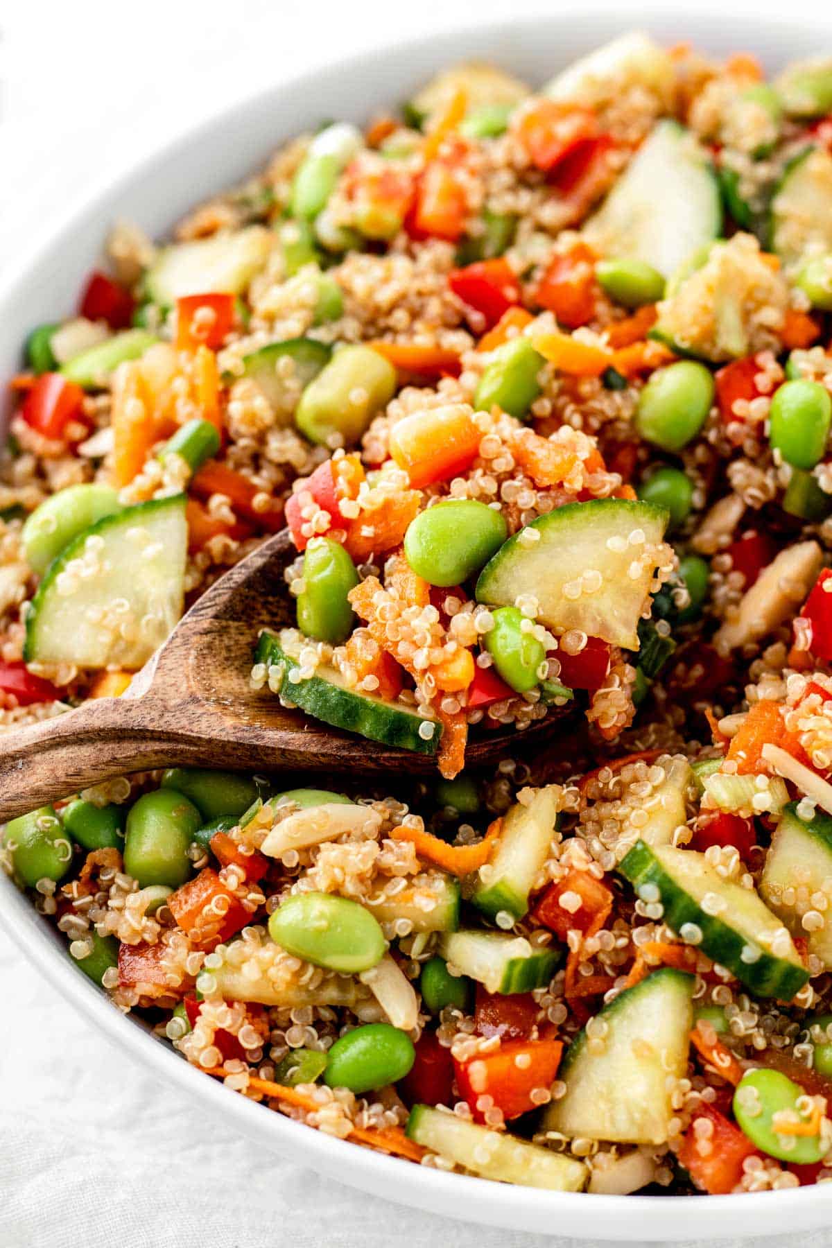 A close-up of a large spoonful of the quinoa edamame salad.