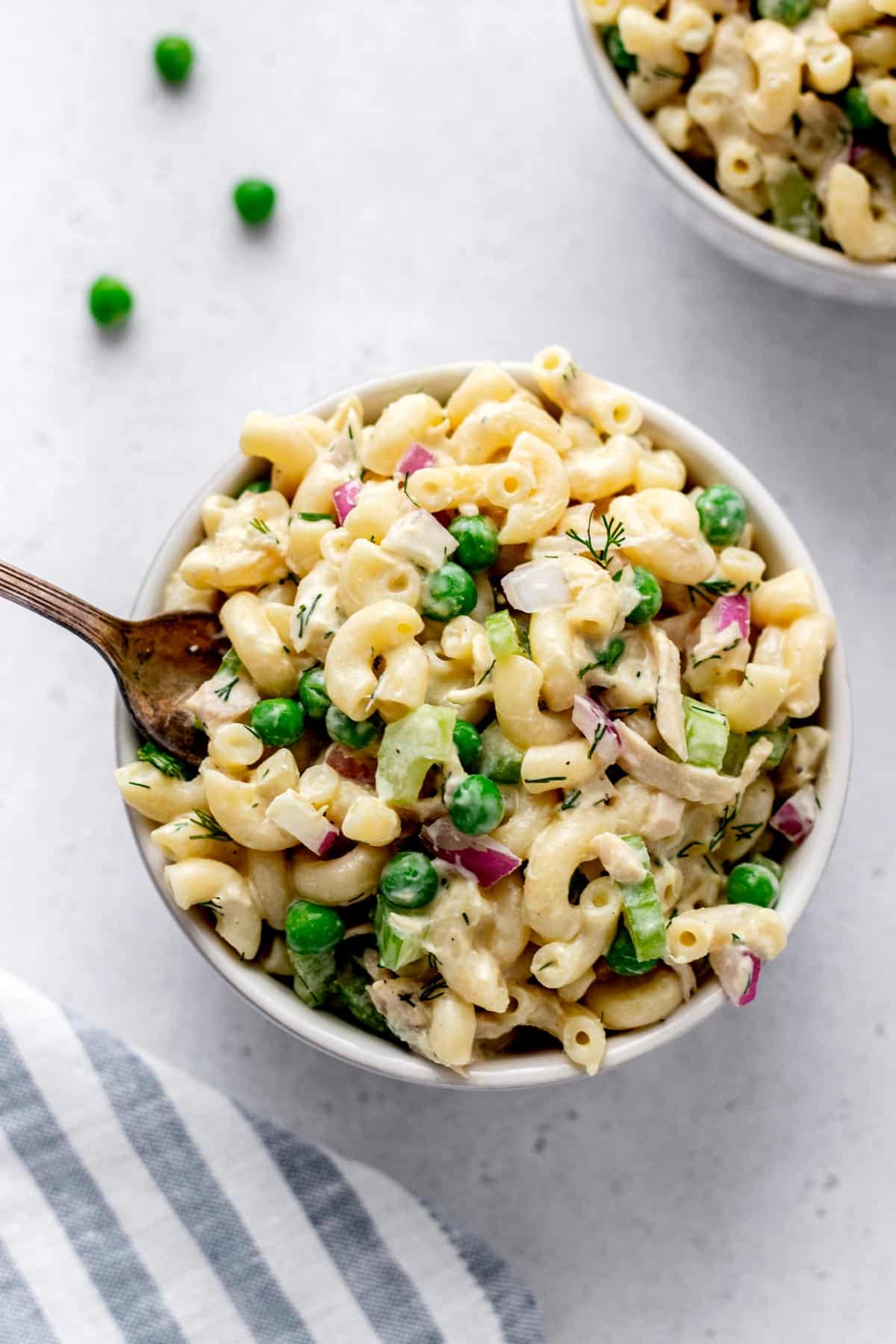 Bird's eye view of tuna macaroni salad with a fork digging in.
