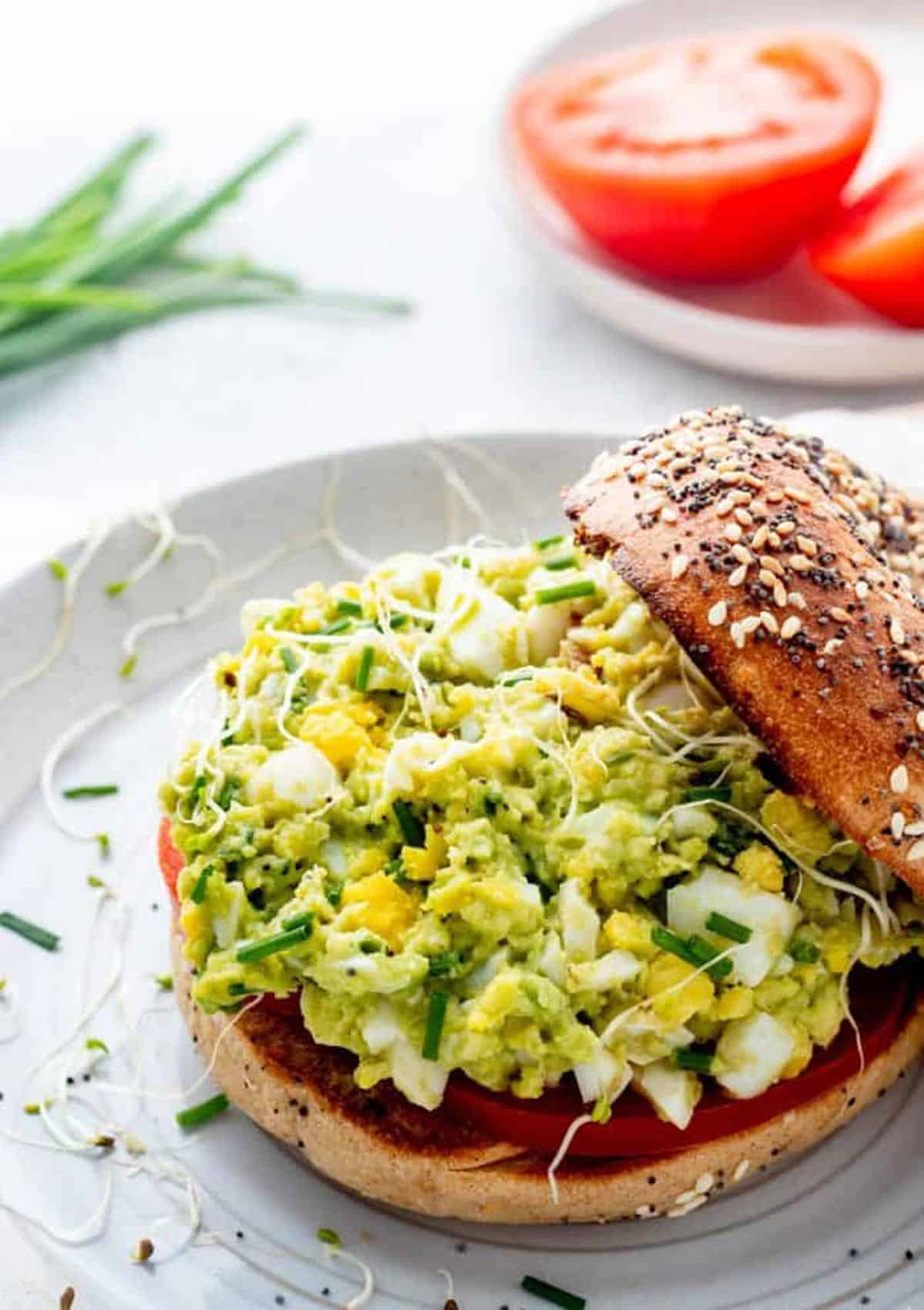 Avocado egg salad on a bagel.