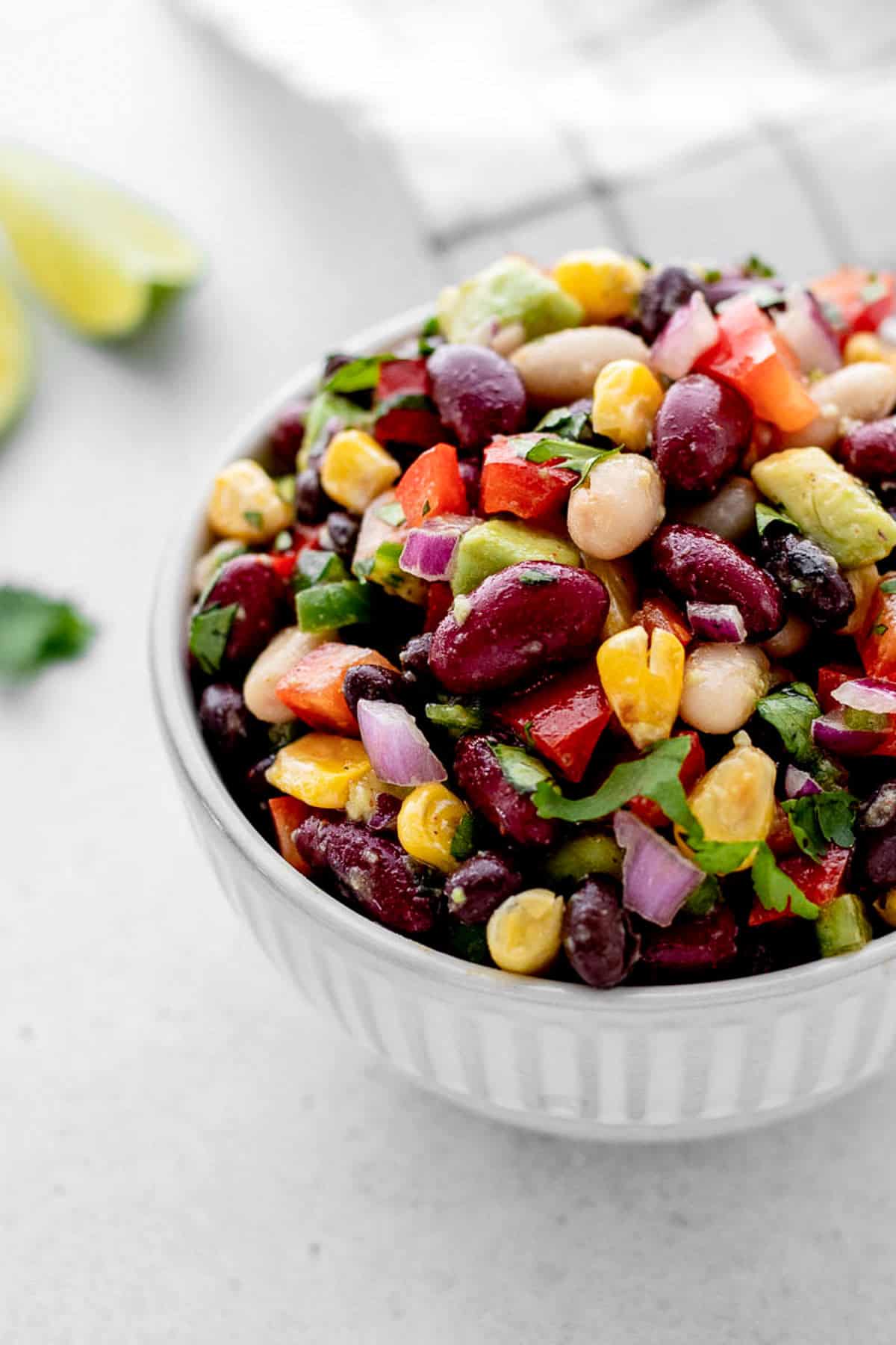 Mixed three bean salad in a small bowl.