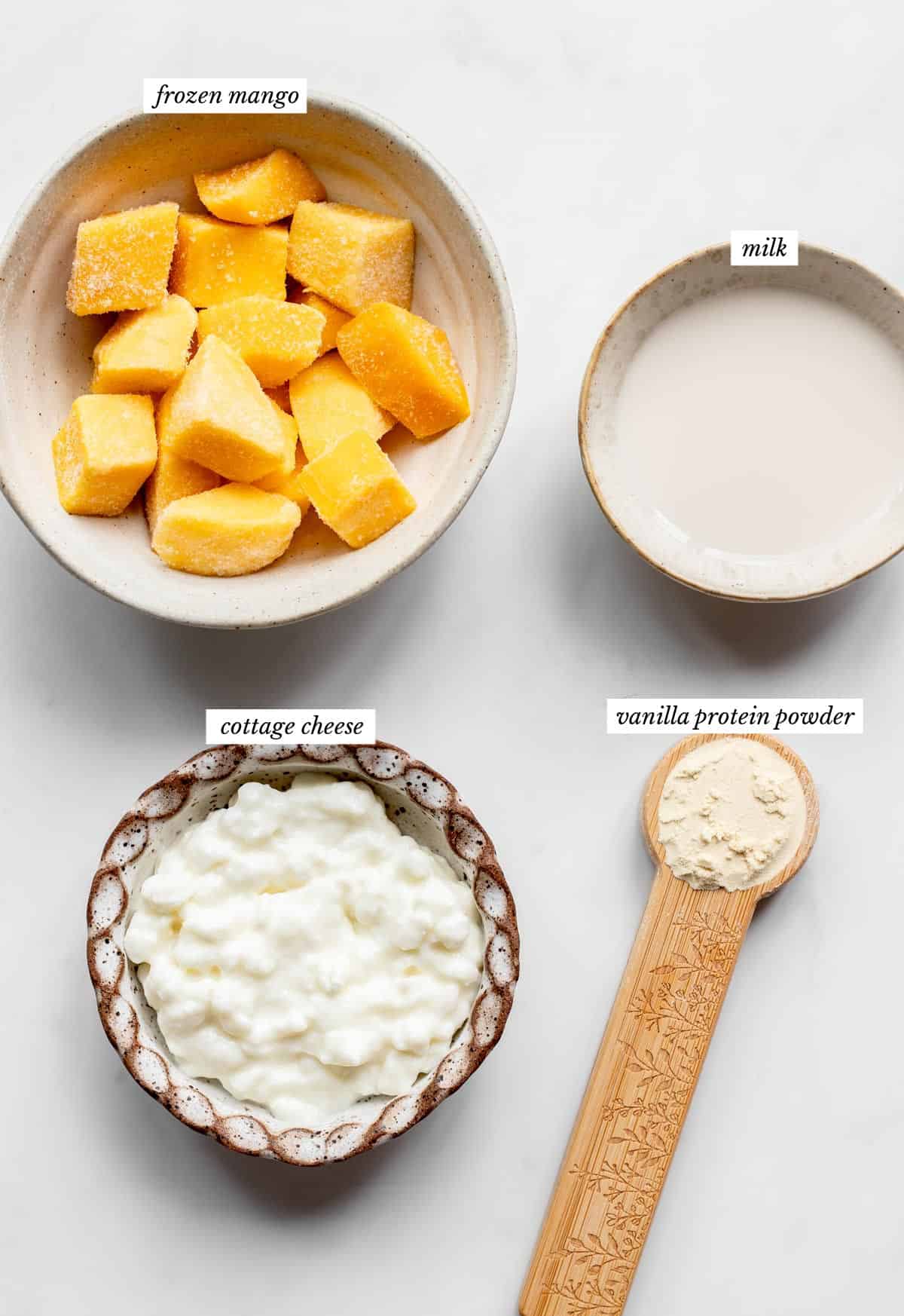 Labeled ingredients for the protein mango dole whip recipe.