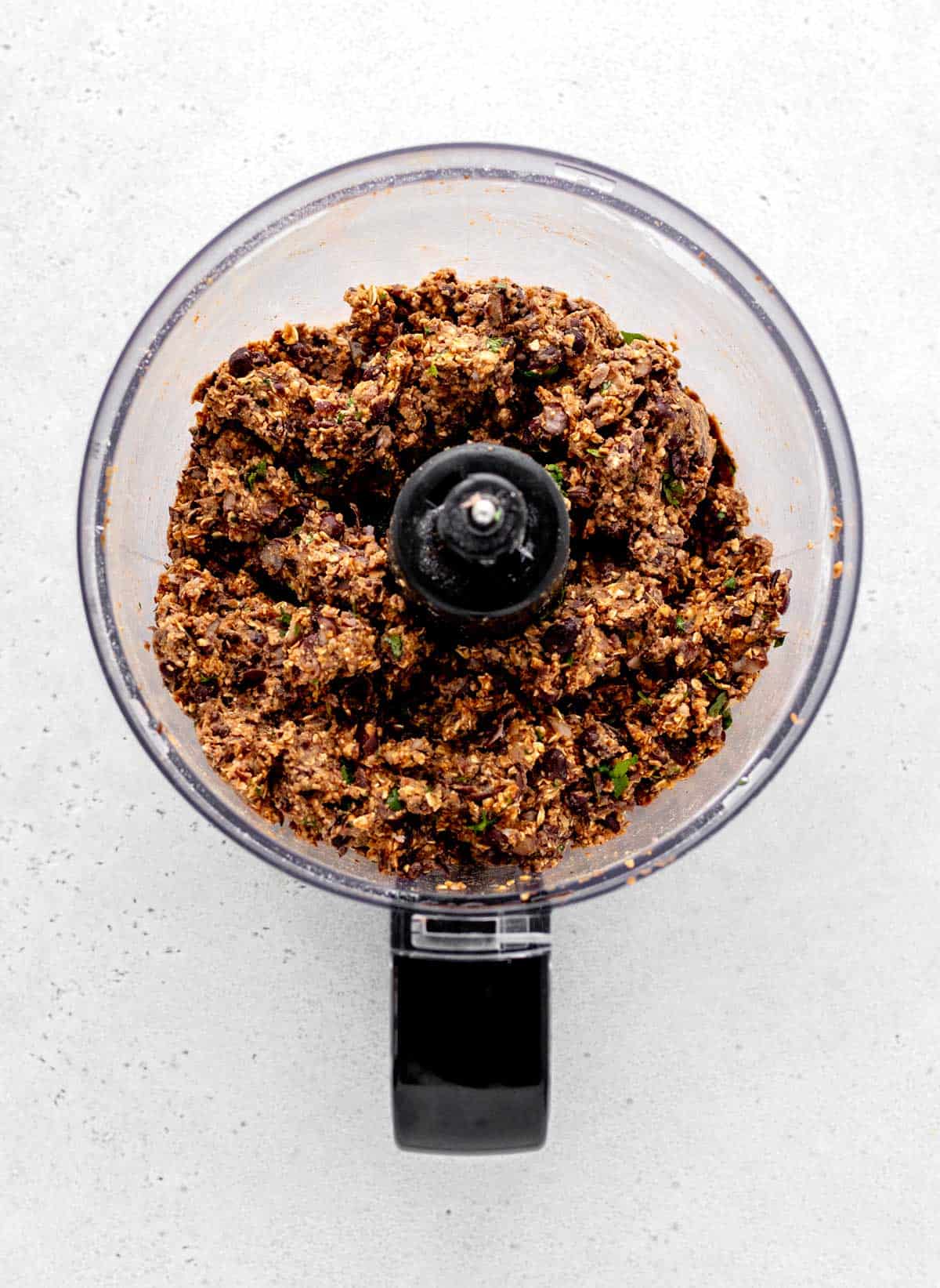 Pureed bean burger mixture in a food processor.