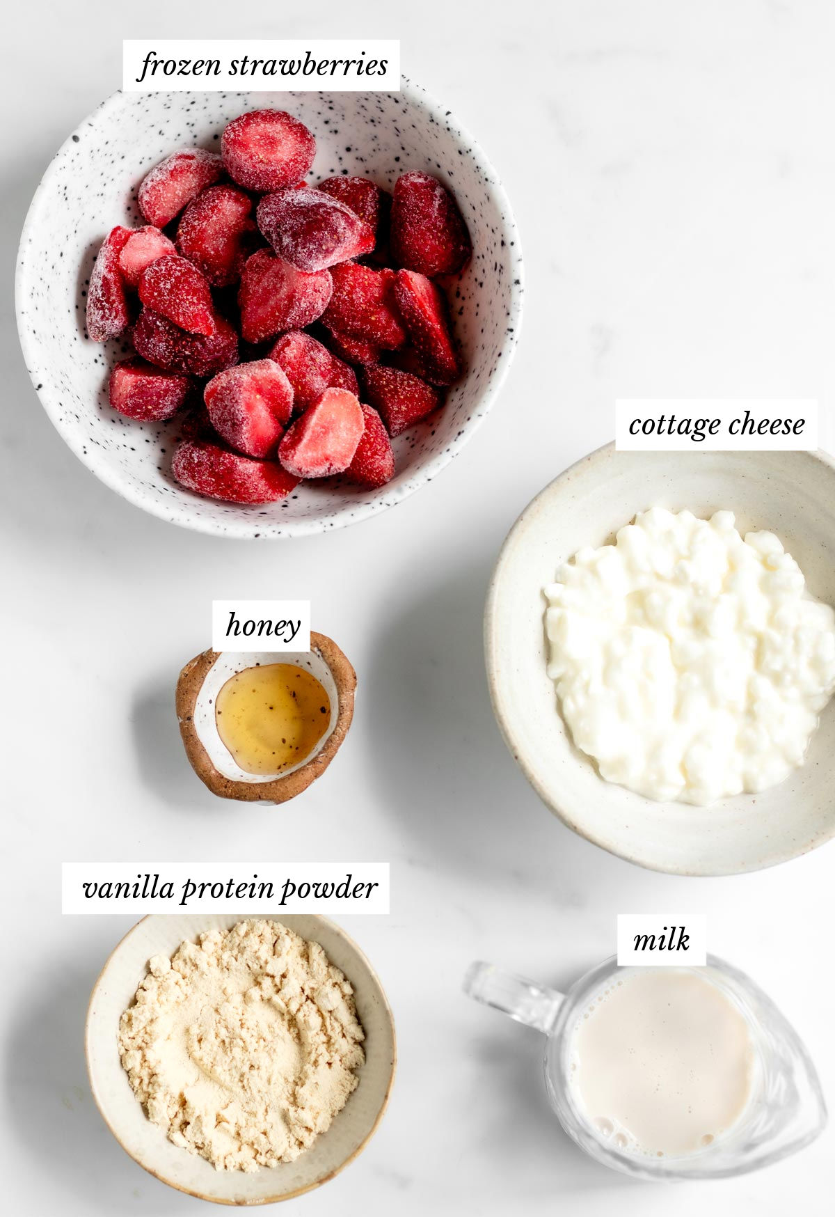 Labeled ingredients for the strawberry cottage cheese dessert recipe.