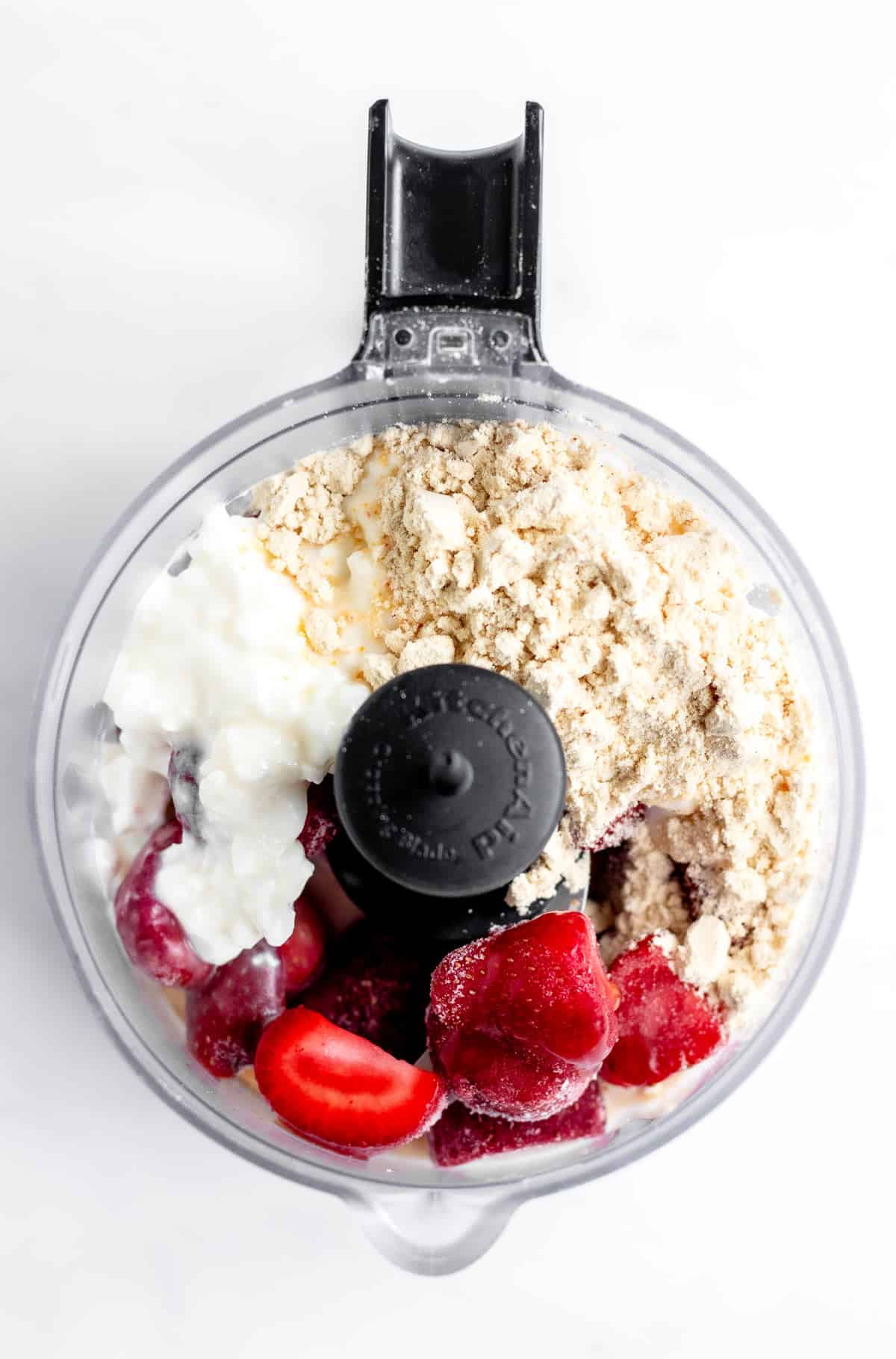 Bird's eye view of the ingredients in a mini food processor.